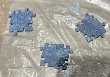 Glueing the screw puzzles on the front.