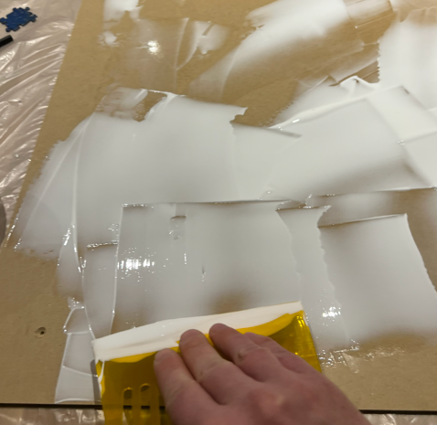 Spreading the glue on the wood